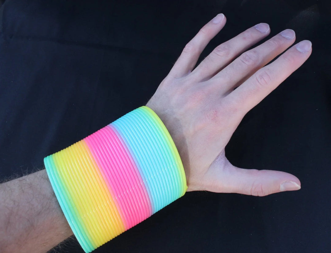 Opaque Rainbow Original HyperSpring, worn as a bracelet on Slinky Josh&