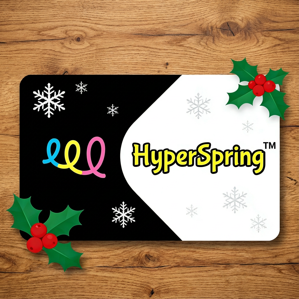 A representation of a HyperSpring gift card sitting on a wooden table, with snowflakes and mistletoe. 