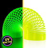 A split-screen product image showcasing The Original HyperSpring™ (3.4") Radioactive Yellow. The left side, under blacklight, shows the spring glowing as a vibrant neon green. The right side shows the spring under normal light, appearing as a bright, radioactive yellow in Rainbow position. A "UV Reactive" badge is visible in the bottom corner.