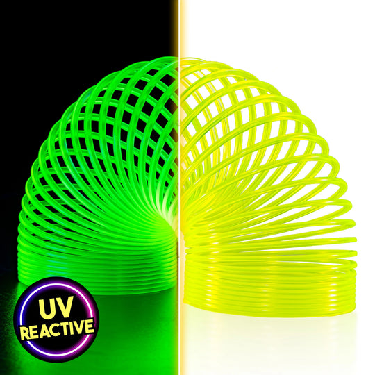 A split-screen product image showcasing The Original HyperSpring™ (3.4") Radioactive Yellow. The left side, under blacklight, shows the spring glowing as a vibrant neon green. The right side shows the spring under normal light, appearing as a bright, radioactive yellow in Rainbow position. A "UV Reactive" badge is visible in the bottom corner.