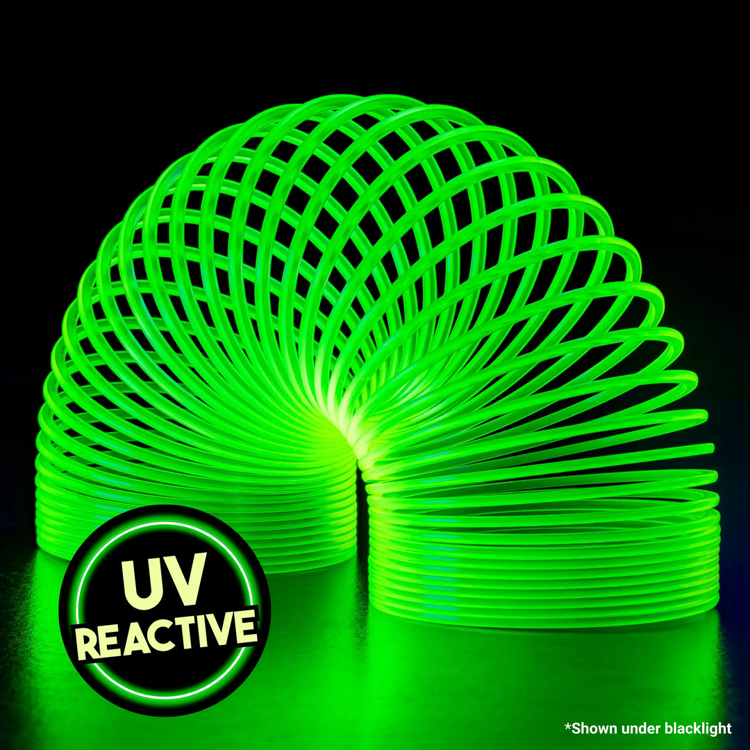 HyperSpring Radioactive Yellow - slinky toy on a black background with &