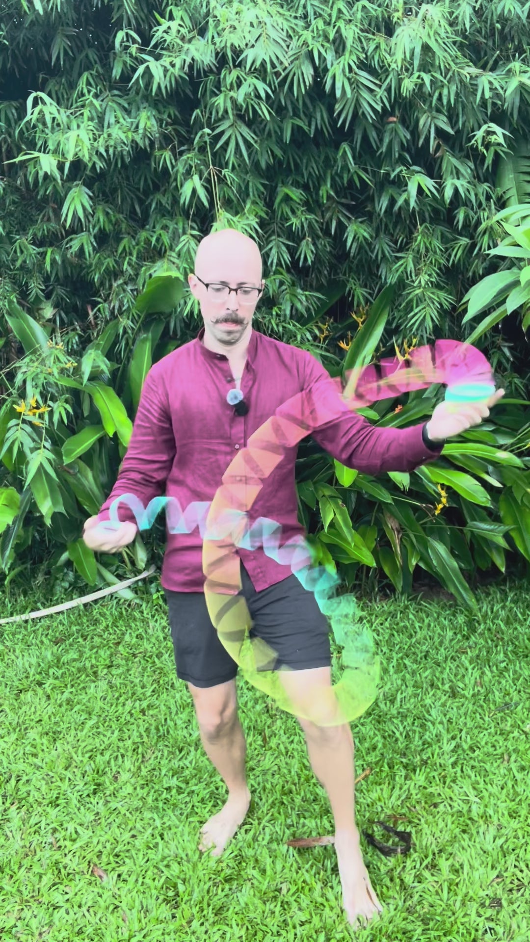 Slinky Josh using an Opaque Rainbow Original HyperSpring, in a green tropical setting