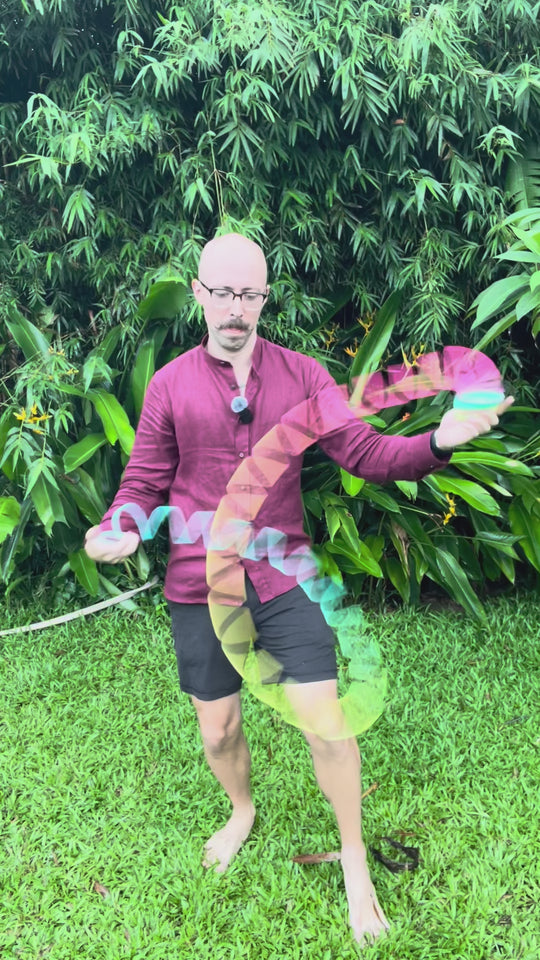 Slinky Josh using an Opaque Rainbow Original HyperSpring, in a green tropical setting